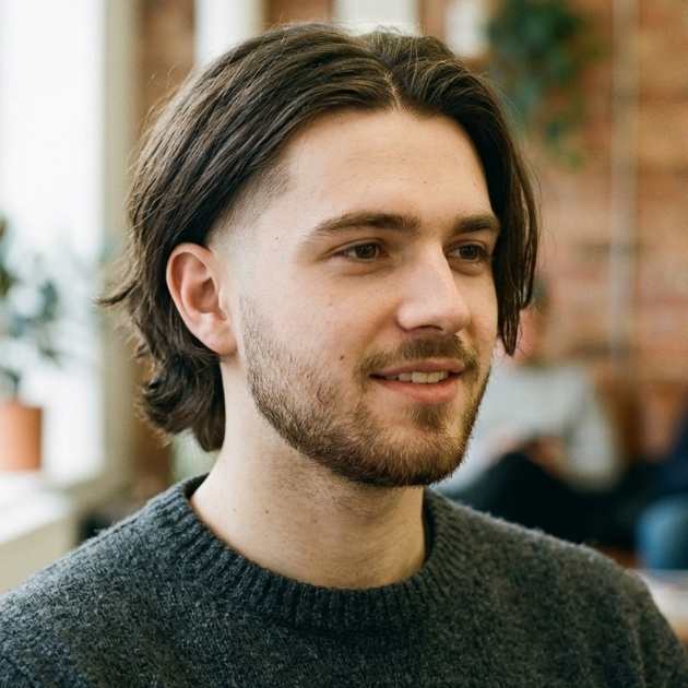 Middle Part Long Hair with a Taper Fade